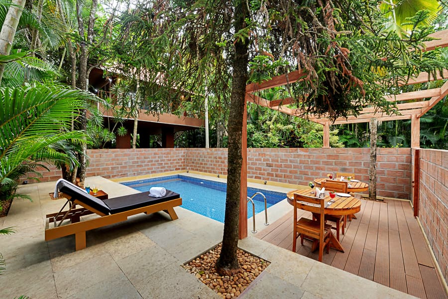 The private plunge pool with a lounger on the sit-out beside it