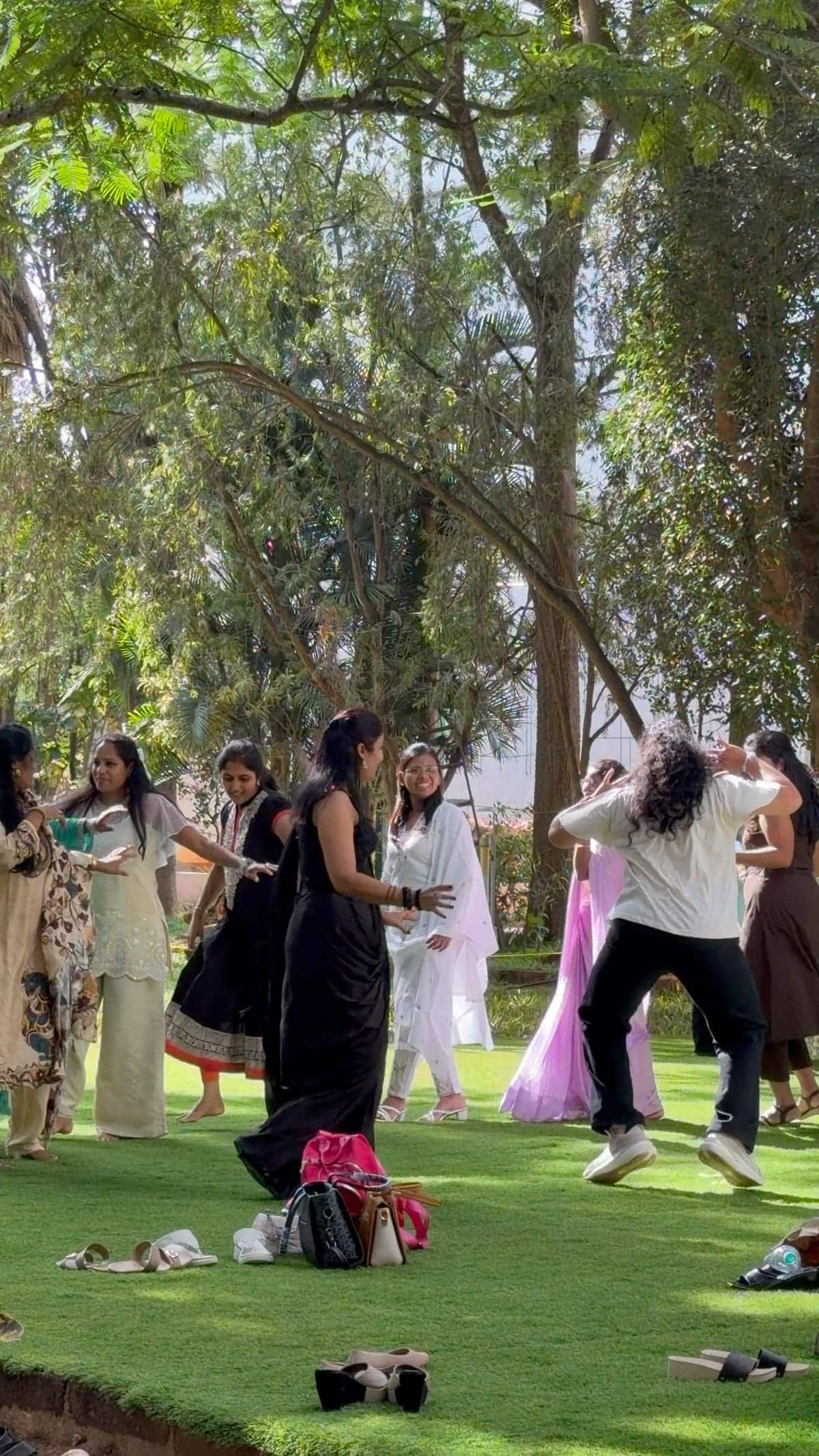 Guests dancing on the lawn during a daytime celebration